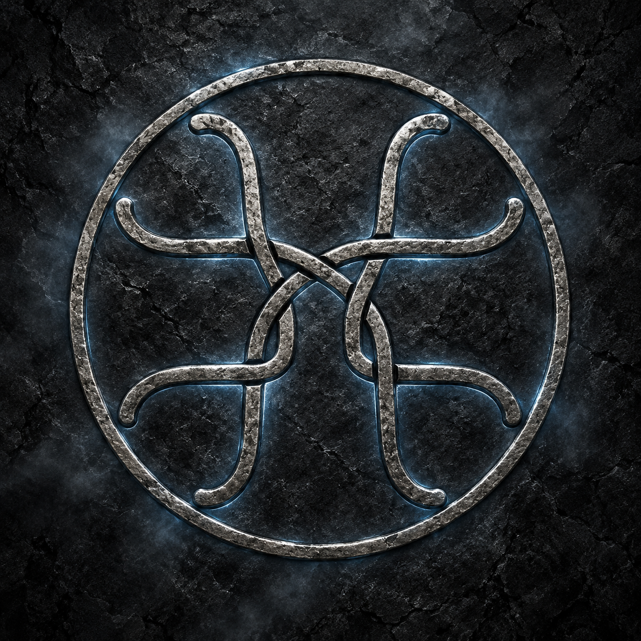 An aged silver Wentworth emblem formed by four flowing lines inside a circle